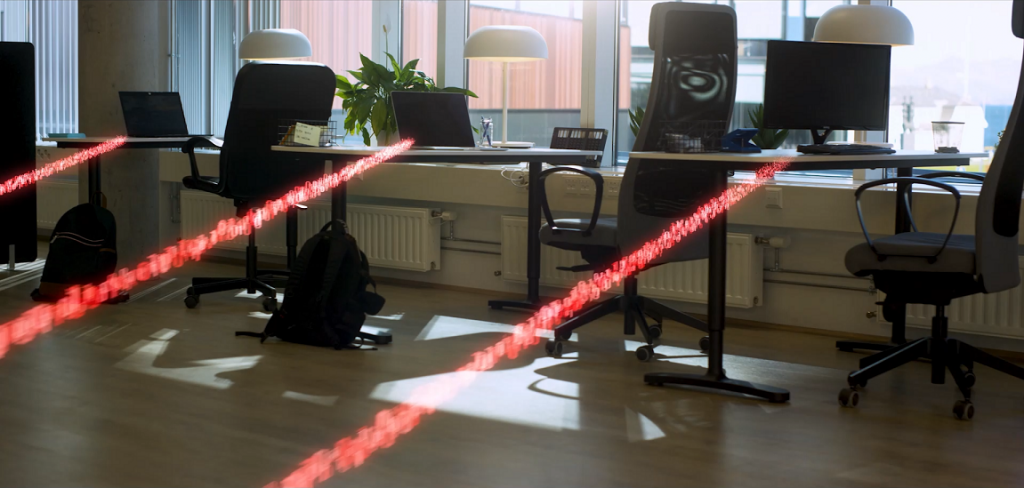 New cybersecurity awareness video about ransomware. Picture shows how ransomware spreads between networked computers metaphorically with red beams. 