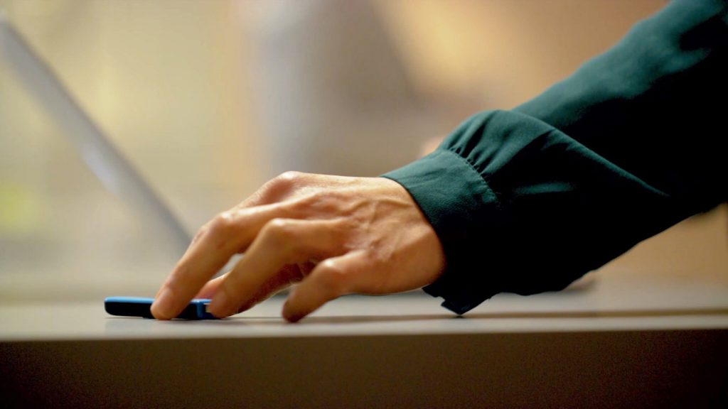 New cybersecurity training video about security culture in the workplace. A woman's hand picking up an unknown usb drive